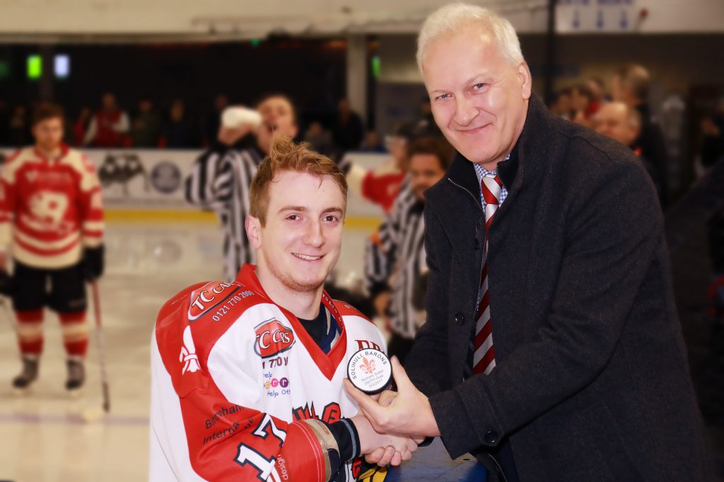 Rich Slater is president with his 200th goal puck by Andy Gordon, Barons co-chair (Steve Crampton)