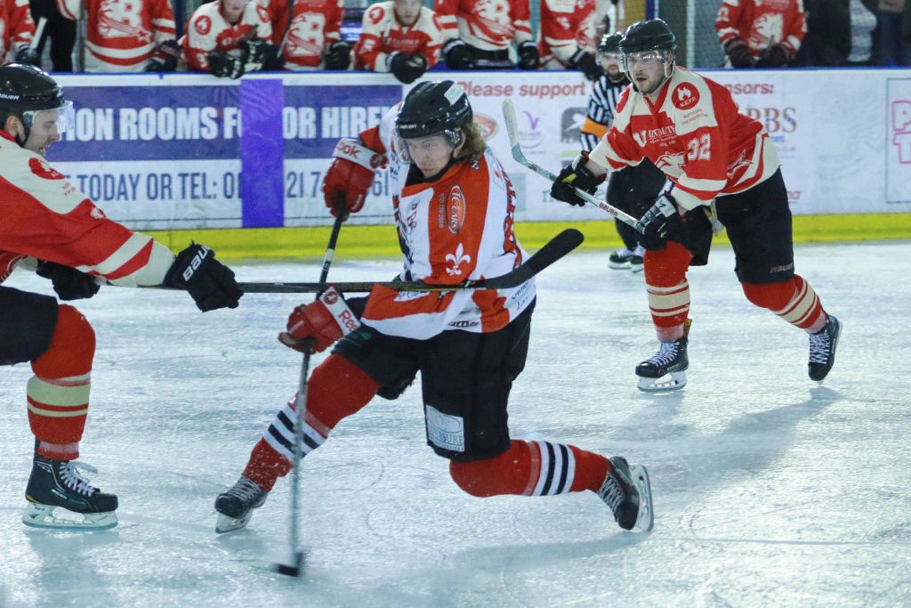 Niklas Ottosson takes a stick to the arm as he drives in on goal (Steve Crampton)