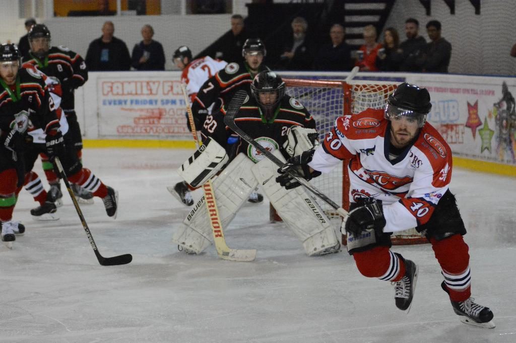 Josh Bruce chases a spilled puck (J&K Davies)