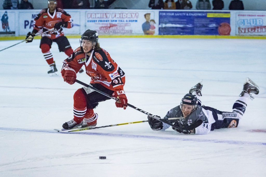 Niklas Ottosson races past a sprawled Thomas Relf (S Crampton)