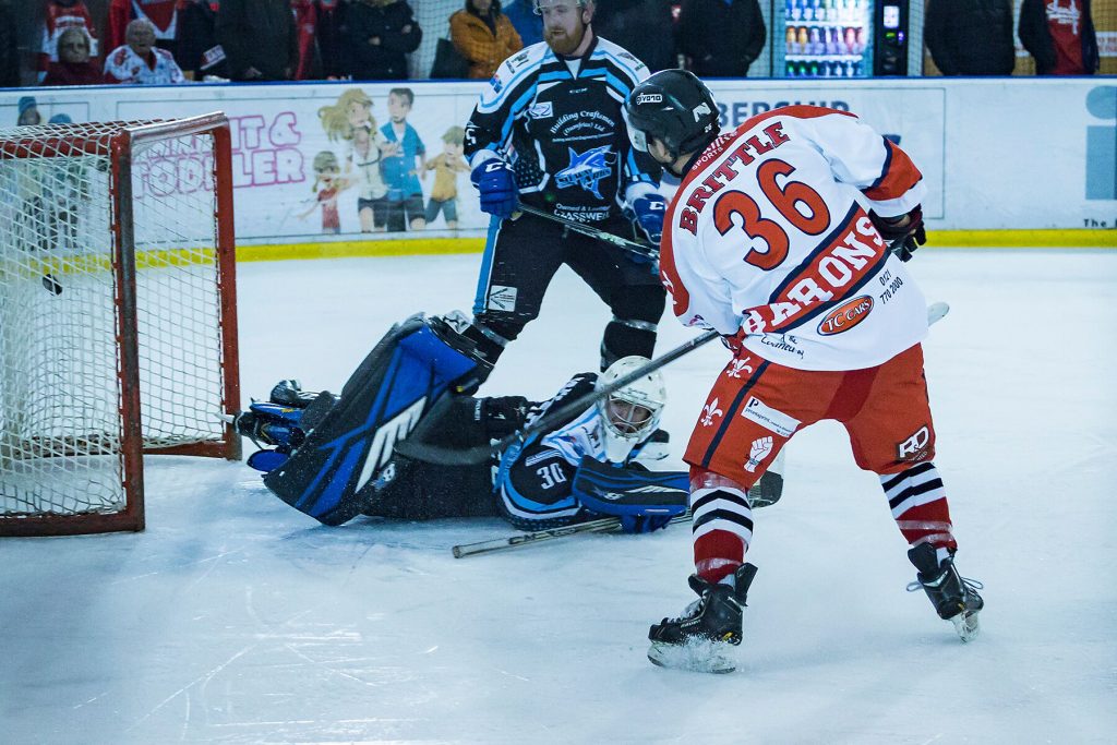 Adam Brittle gets the Barons opener as game winner Kyle Horne looks on (Steve Crampton)