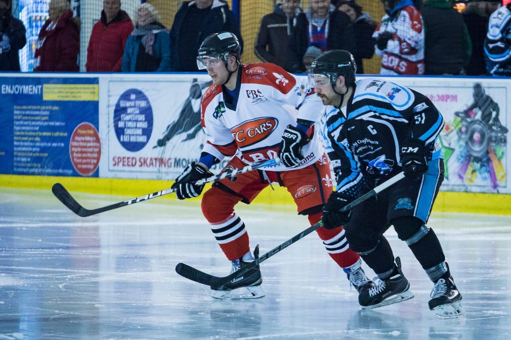 Tom Soar of the Barons and Struan Tonner of the Sharks follow the play (Steve Crampton)