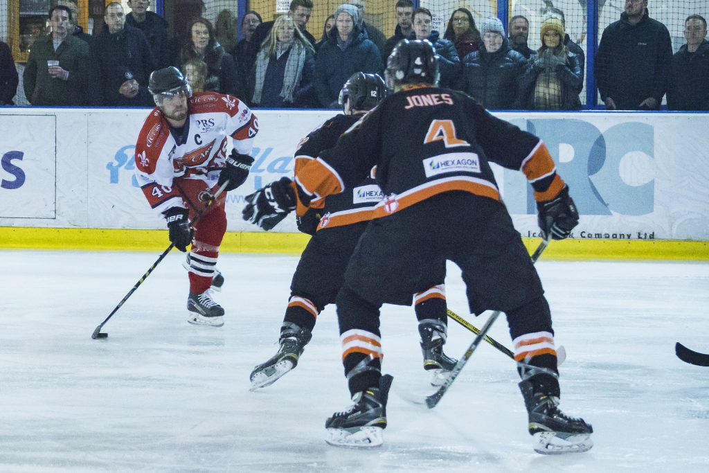 The Tigers defence tries to block Josh Bruce (Steve Crampton)