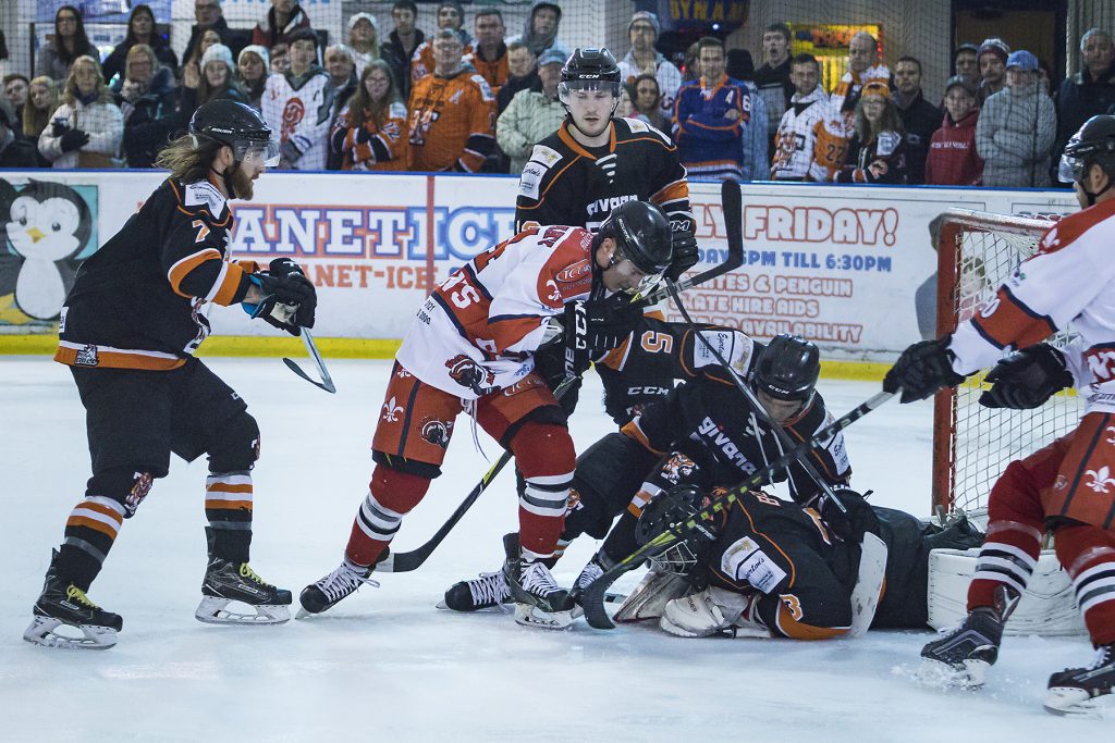 Dennis Bell covers the puck (Steve Crampton)